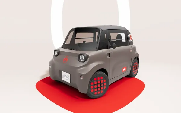 Citroën Ami in Grau mit roten Radkappen, schräg von vorne